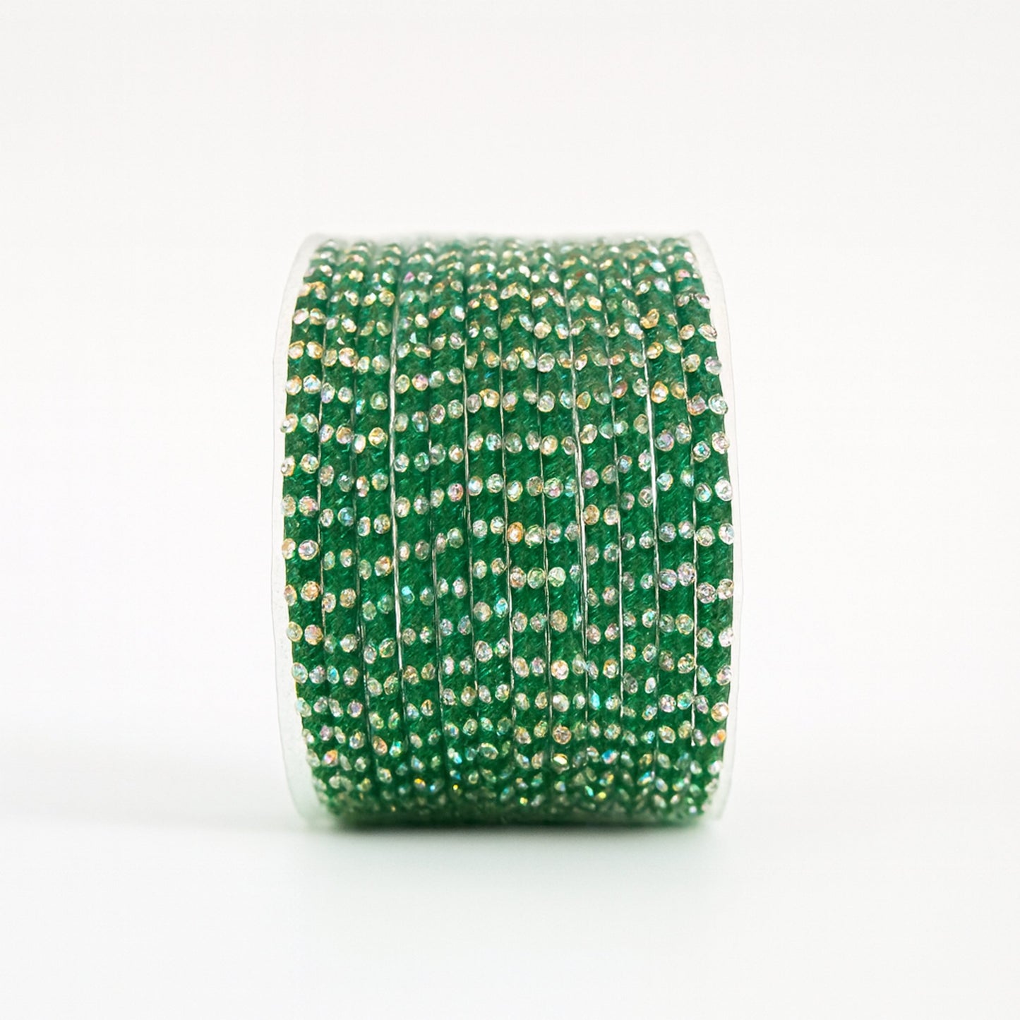 Green decorative bangles with rhinestones on a white background
