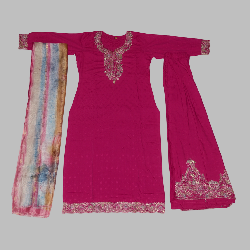 Pink traditional outfit with embroidered details on a white background