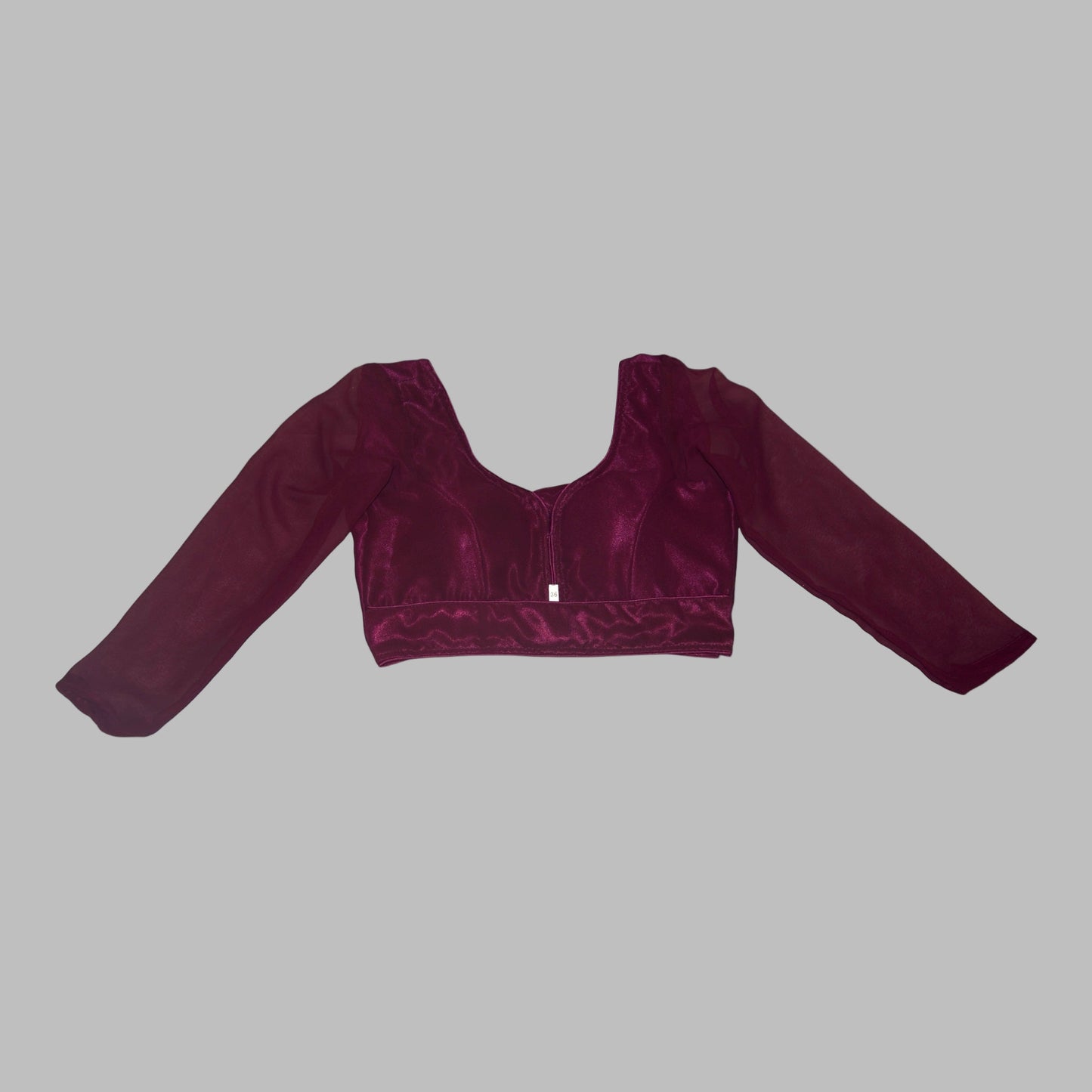 Maroon velvet crop top on a white background