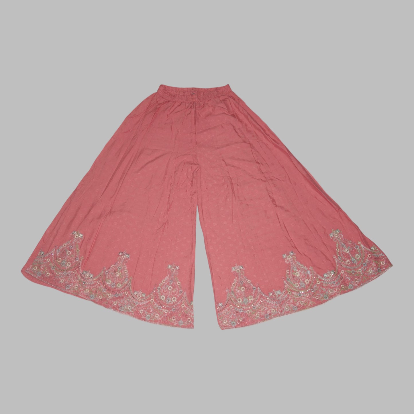 Pink pants with floral embroidery on a white background