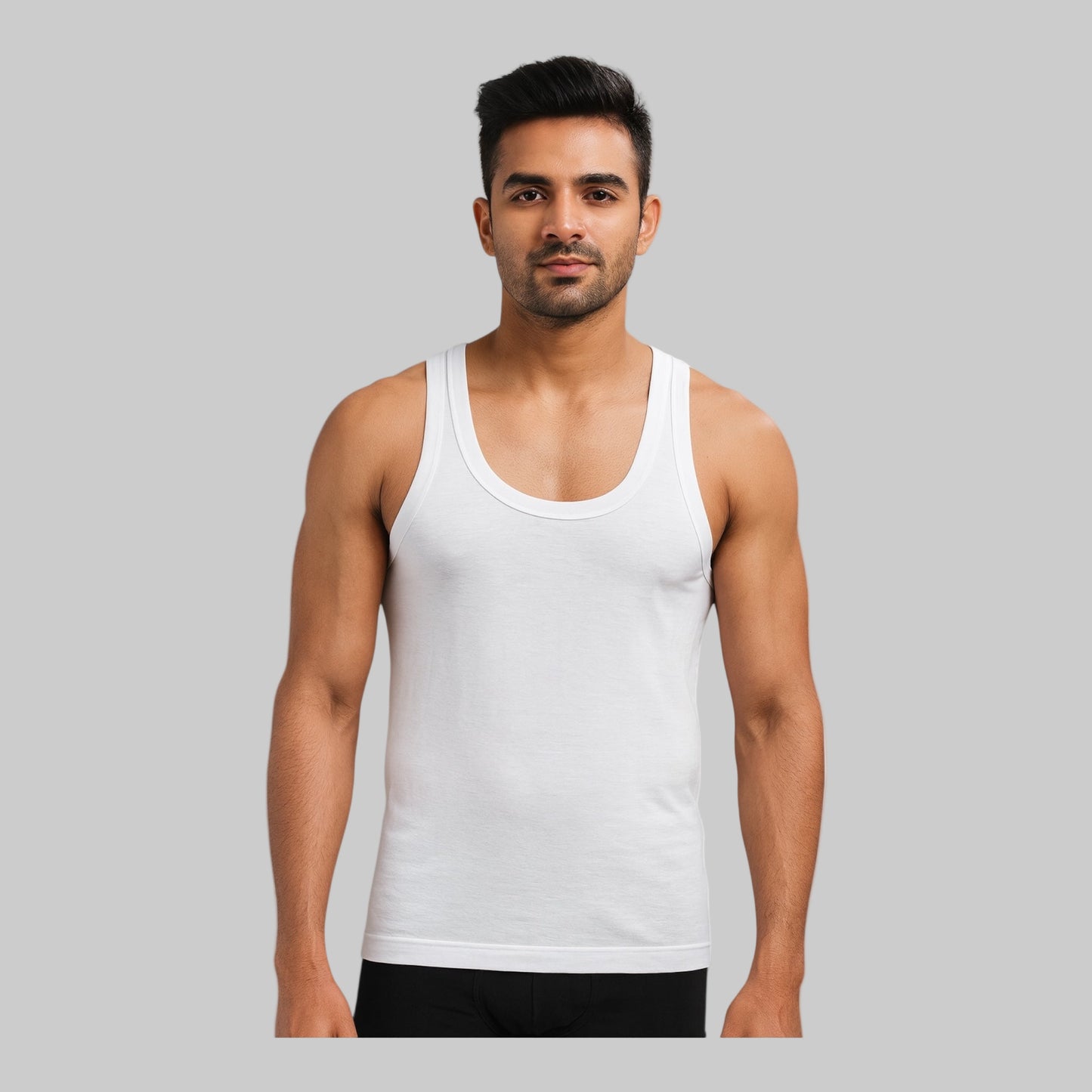 Man wearing a white tank top on a white background
