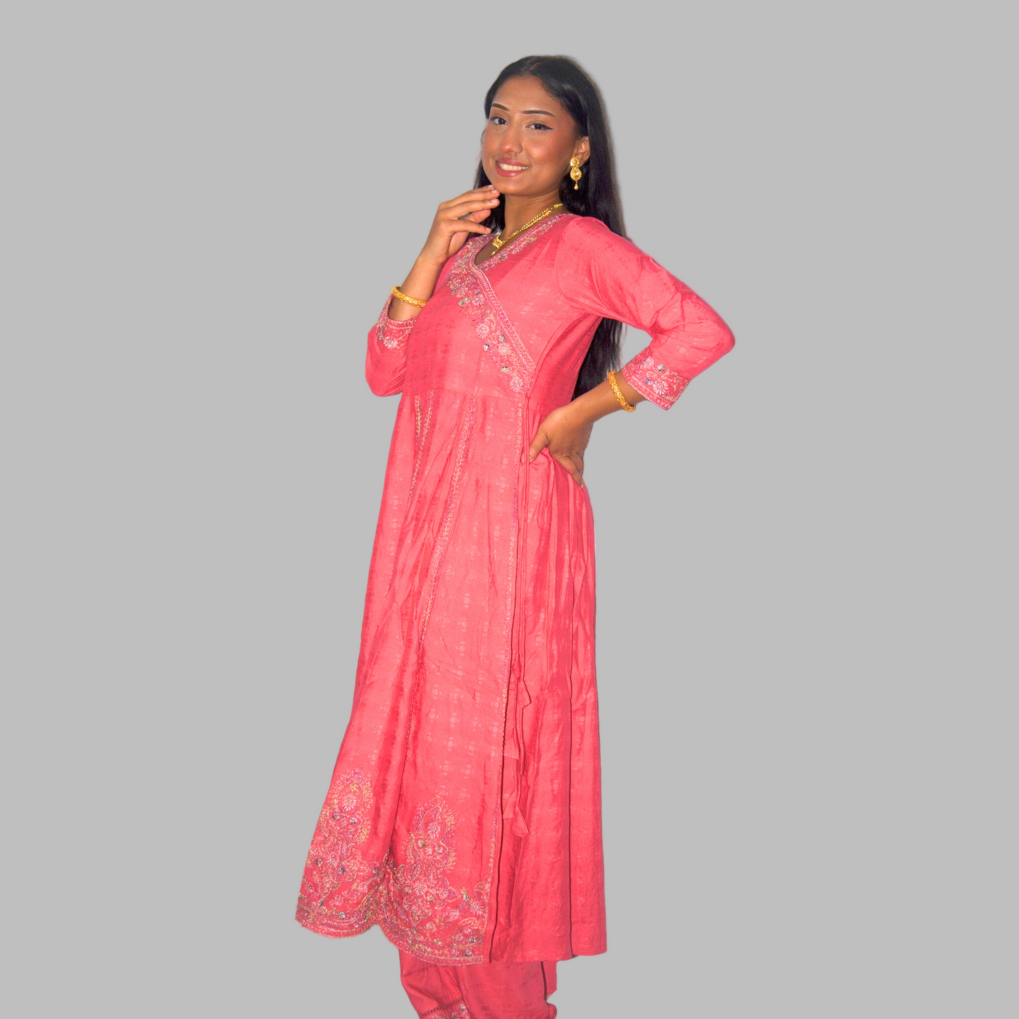 Woman wearing a pink traditional outfit on a white background
