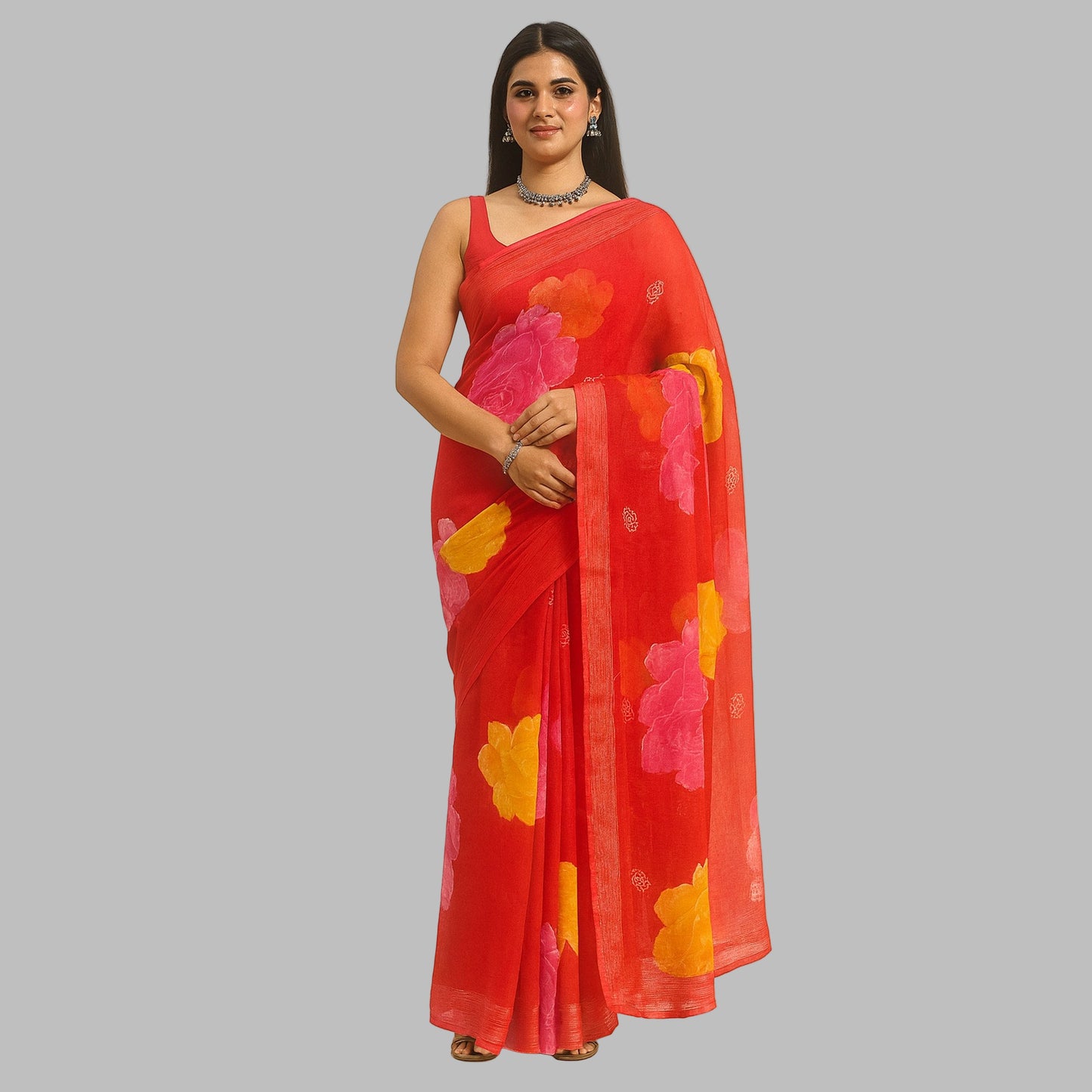 Woman wearing a red saree with floral patterns on a beige background