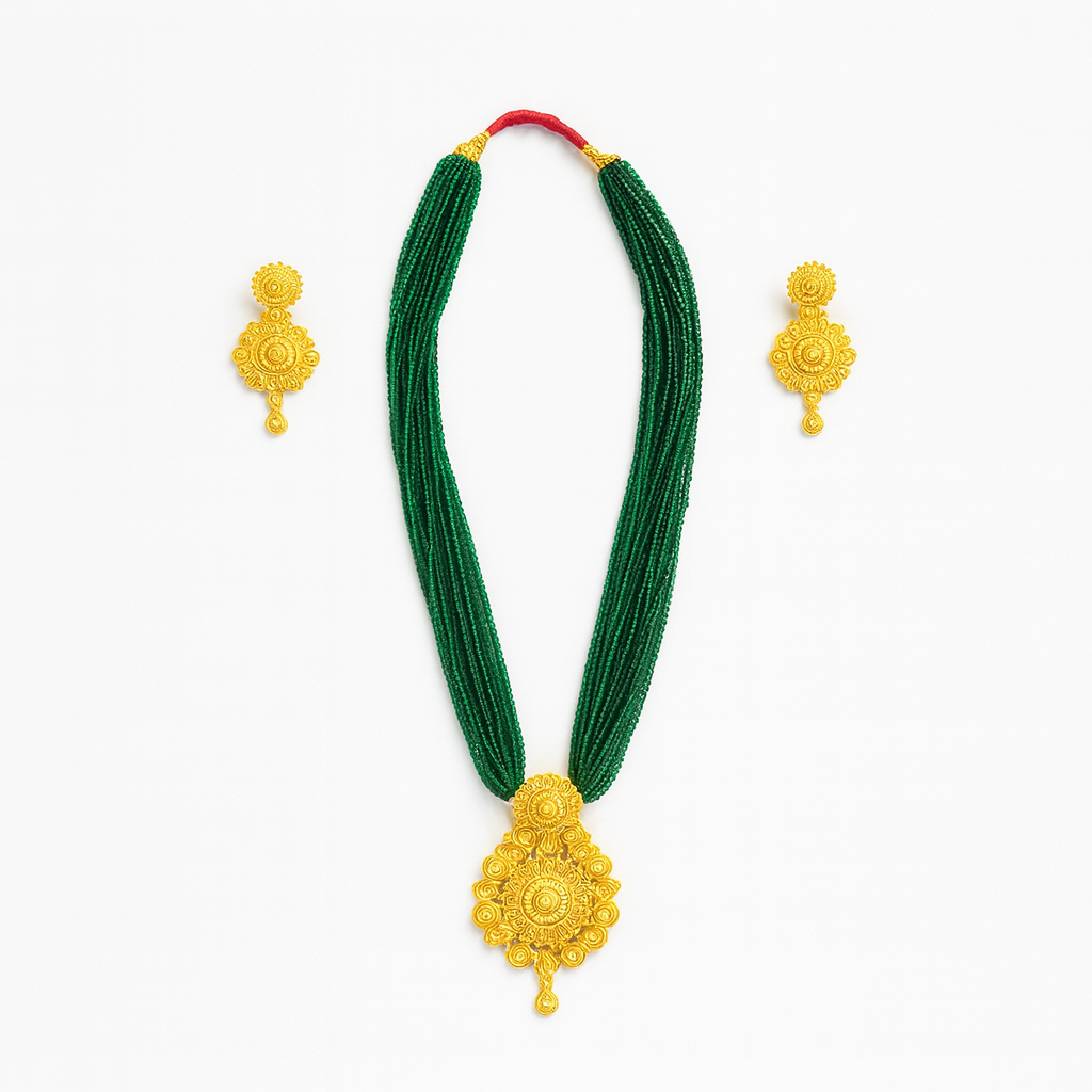 Green necklace with gold pendants and matching earrings on a white background