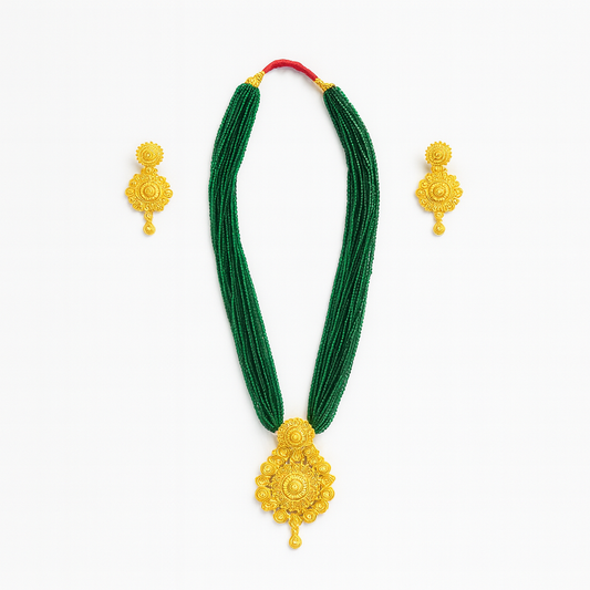 Green necklace with gold pendants and matching earrings on a white background
