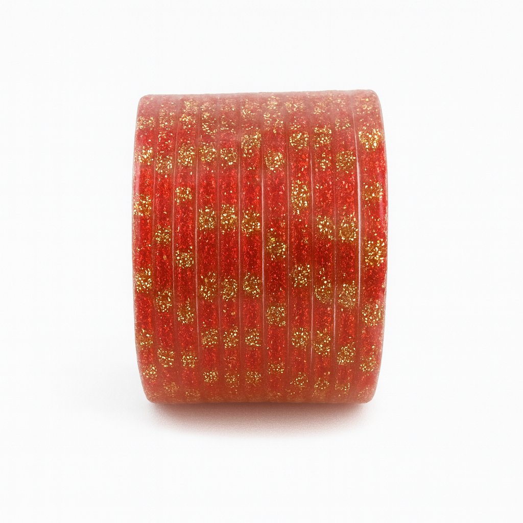 Red decorative roll with gold glitter pattern on a white background