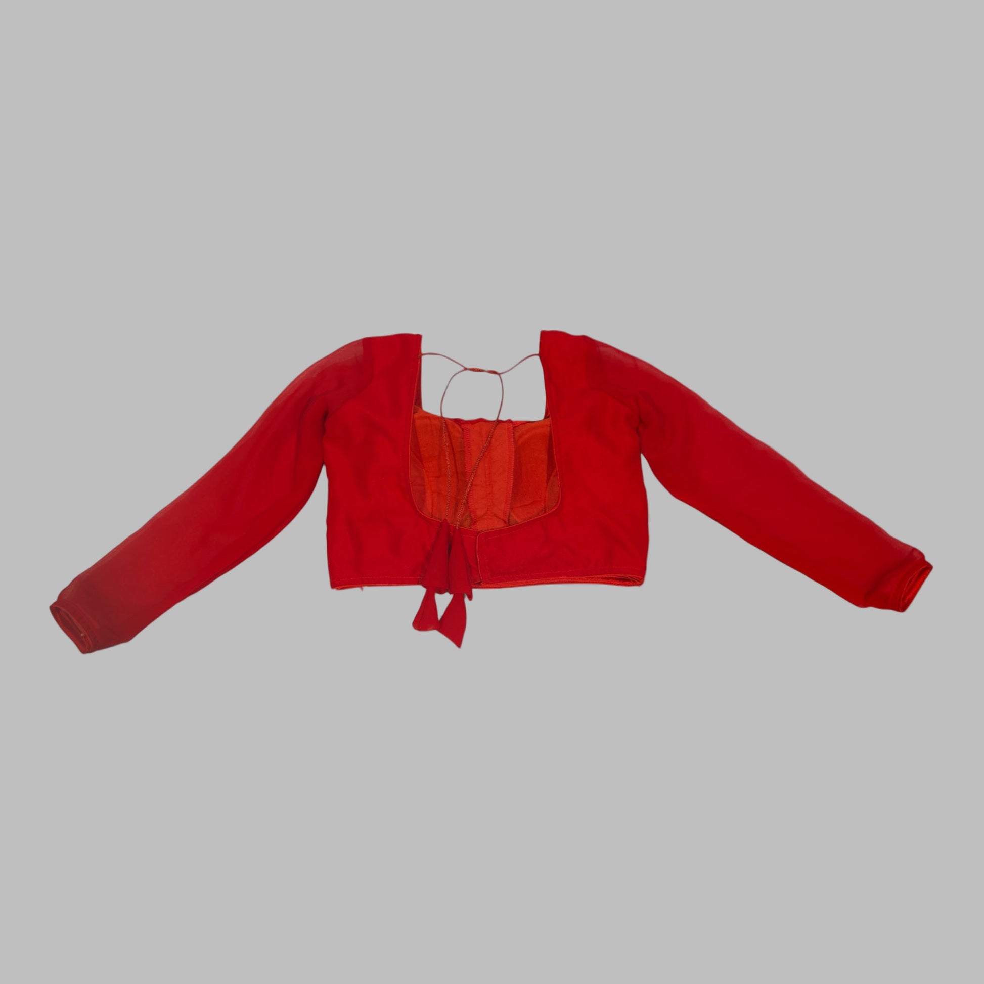 Red crop top with long sleeves on a white background