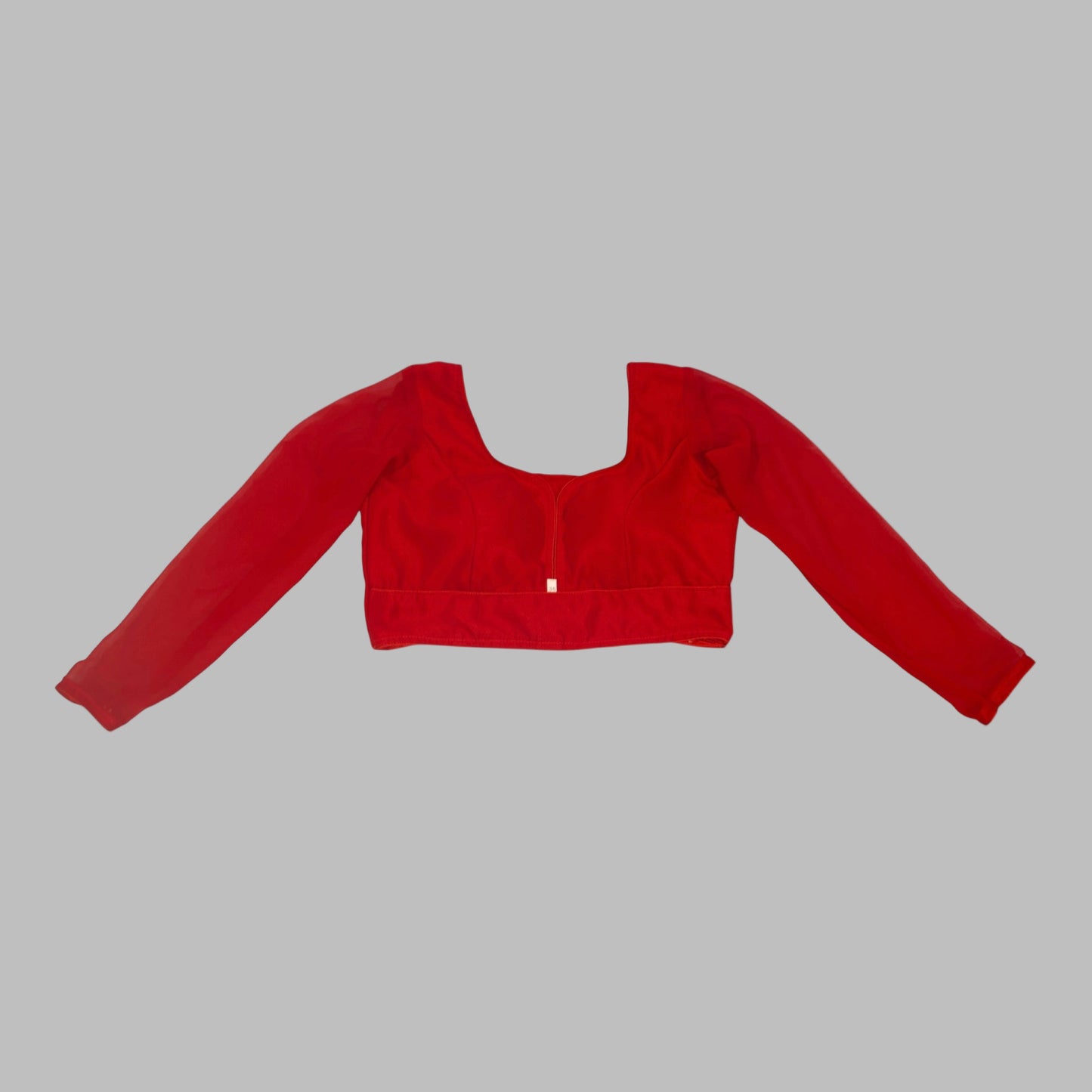 Red crop top with long sleeves on a white background