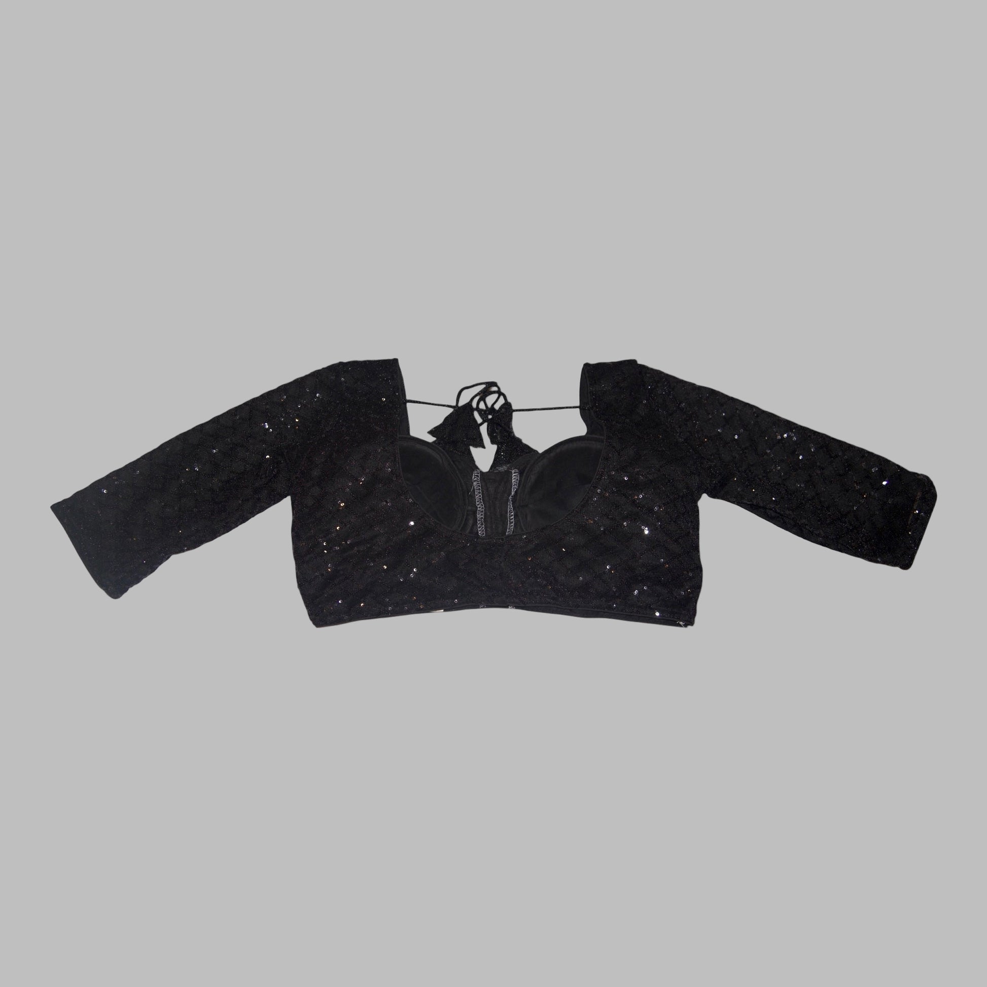 Black textured crop top on a white background