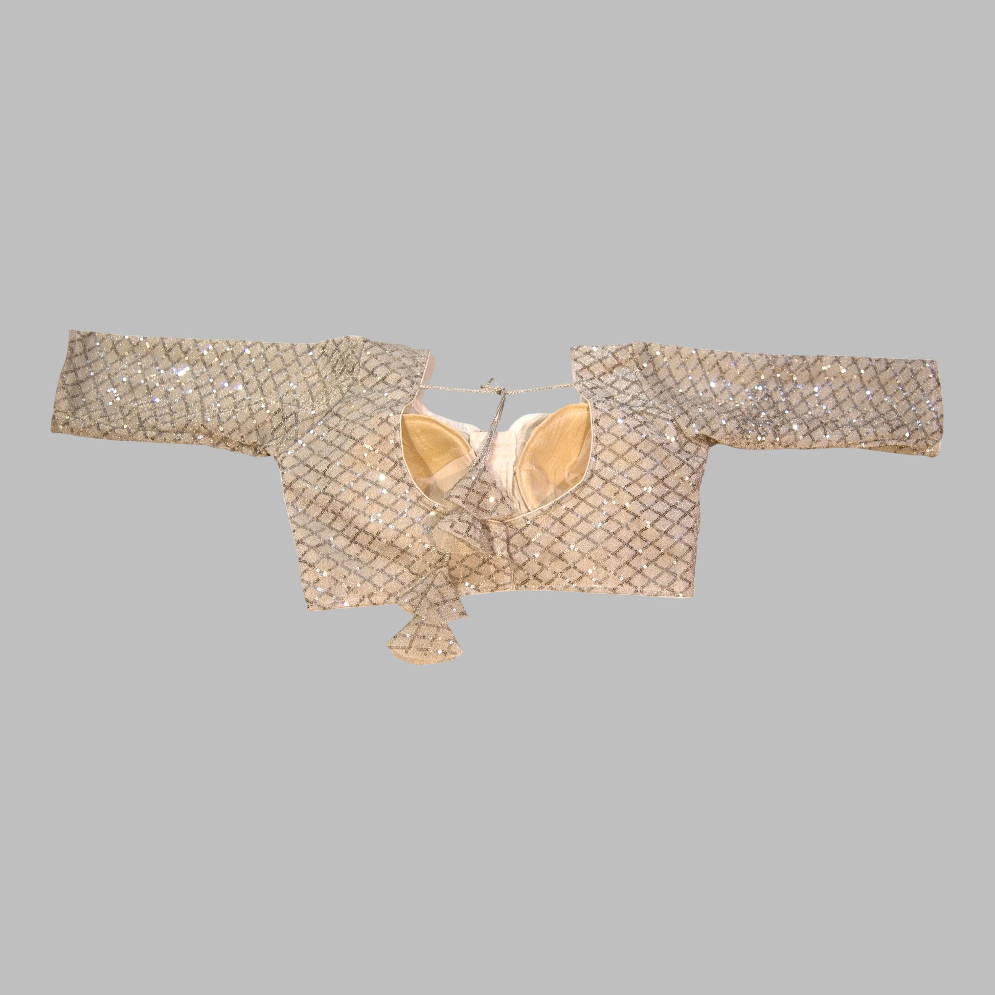 Beige embroidered blouse on a white background