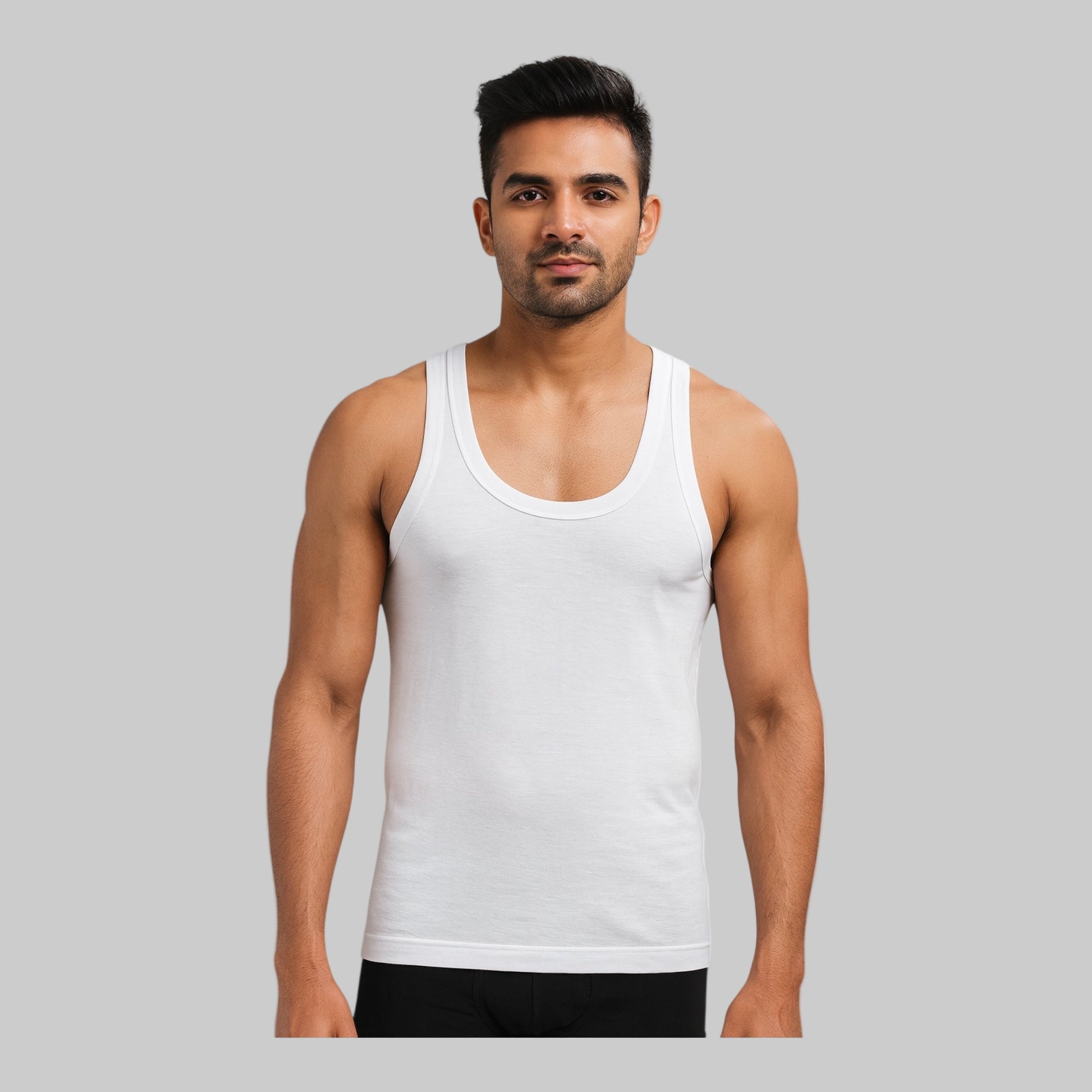 Man wearing a white tank top on a white background