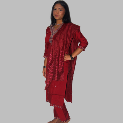 Woman wearing a red traditional outfit against a white background