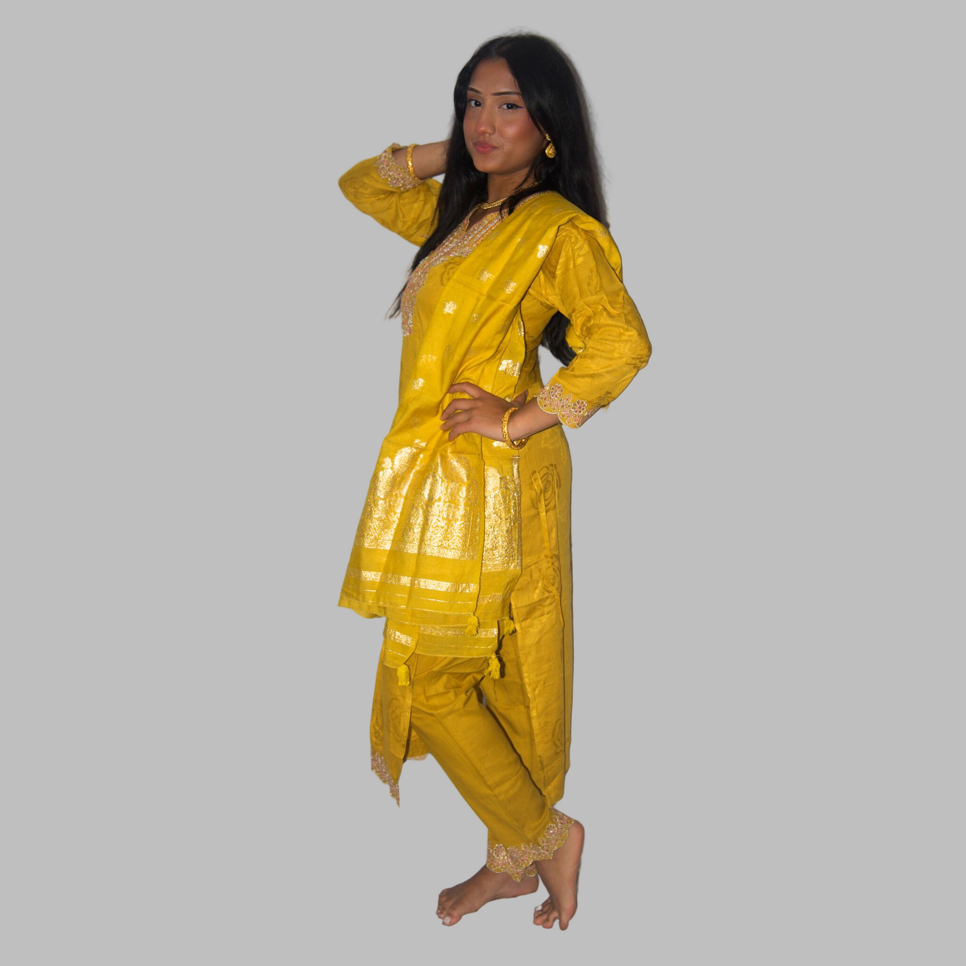 Woman wearing a yellow traditional outfit on a white background