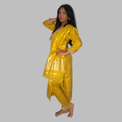 Woman wearing a yellow traditional outfit on a white background
